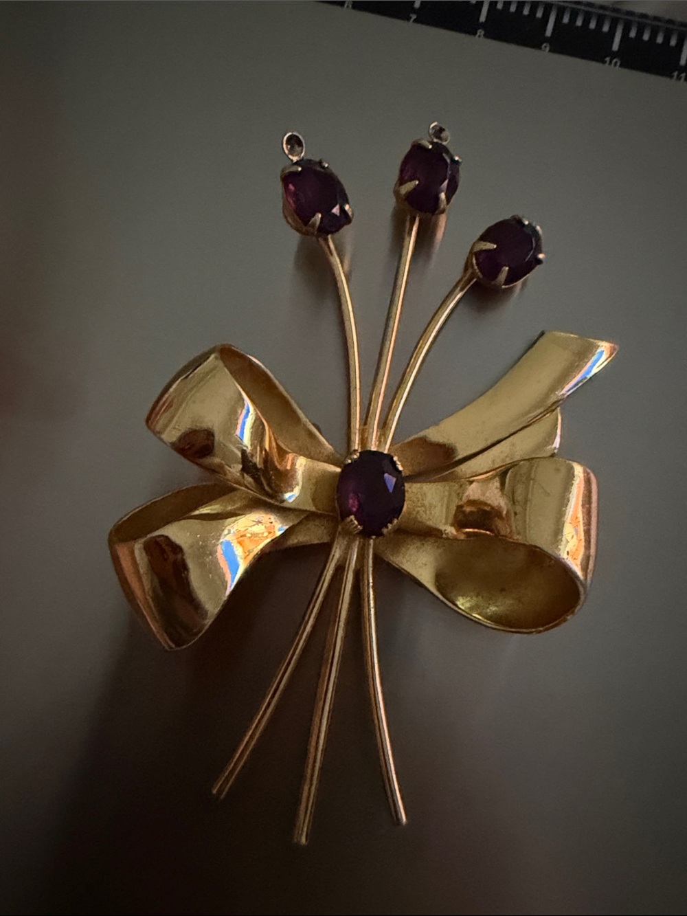 Coro vintage Gold Tone Bow Brooch with Deep Purple Stones